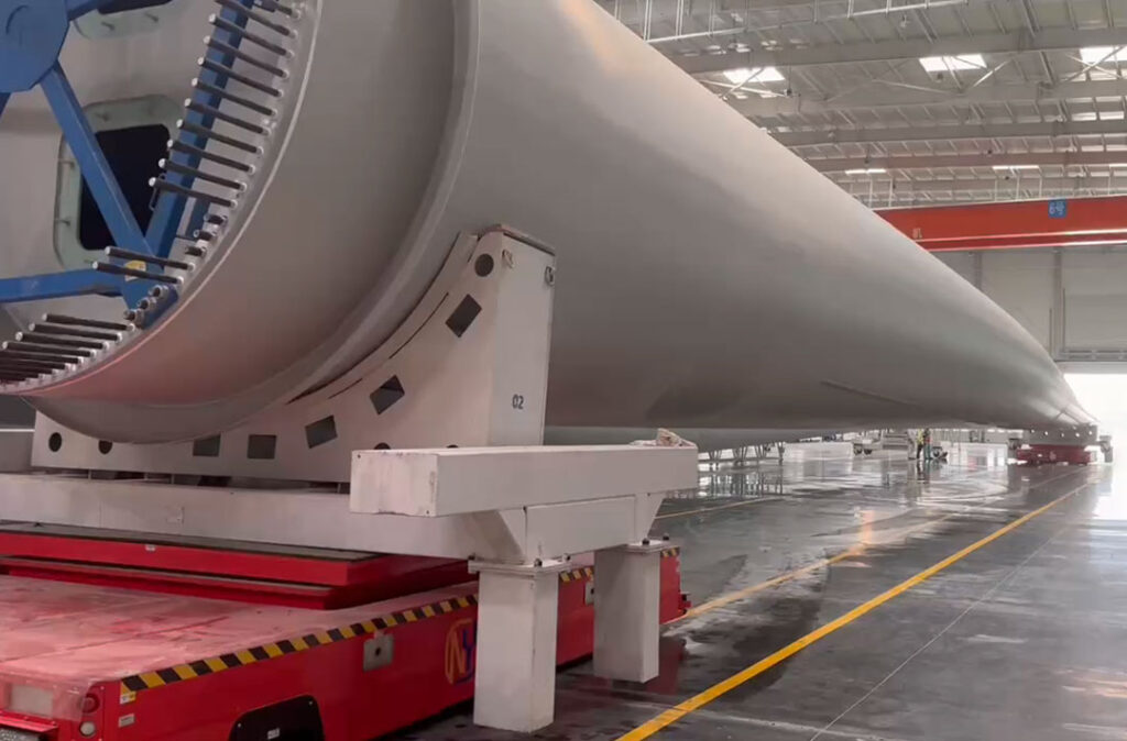 how dual vehicle agvs solve the mega challenge of 100 meter wind turbine blade transport 3