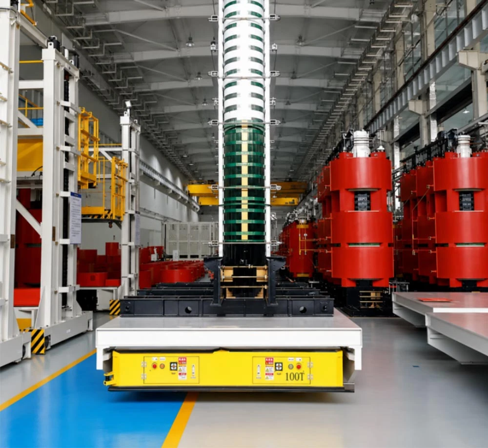 100-ton heavy-duty AGV transporting transformer coils and large power equipment components in an industrial manufacturing factory banner