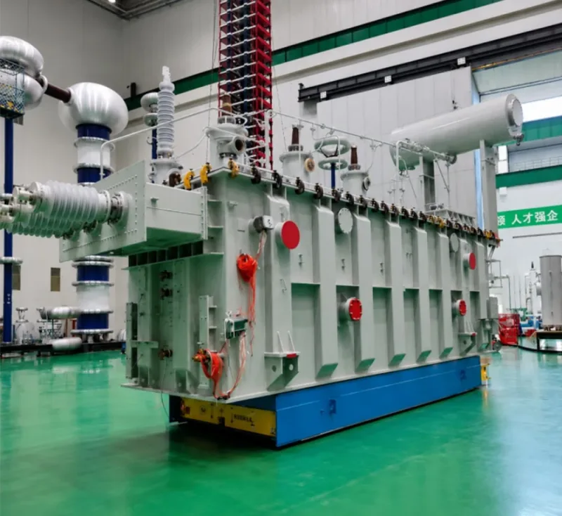 200-ton omnidirectional lifting AGV transporting a large power transformer inside a transformer manufacturing facility banner