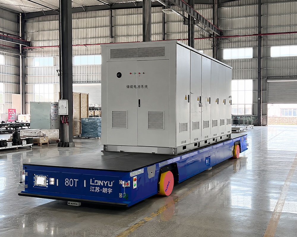 Blue Lonyu 80T trackless AGV transfer cart carrying an energy storage battery system container.